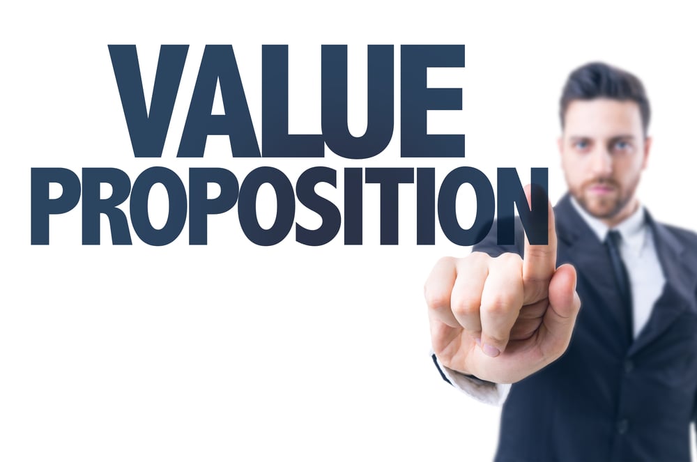 Business man pointing the text Value Proposition Business man pointing the text Value Proposition